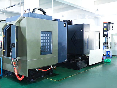 CNC milling machine in action producing custom machined aluminum parts